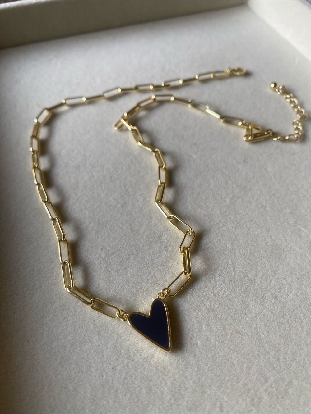 UNCOMMON JAMES gold chain necklace with Black heart charm.